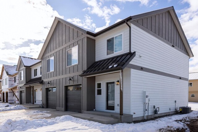 modern farmhouse featuring a garage