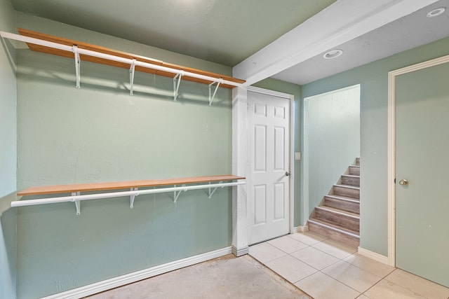 spacious closet featuring light tile patterned floors