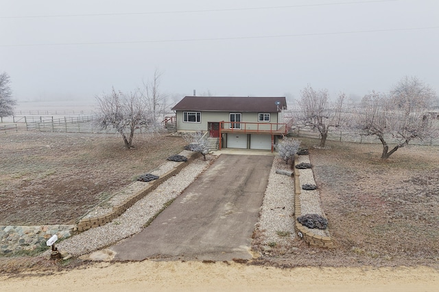 view of front of house featuring a deck and a garage