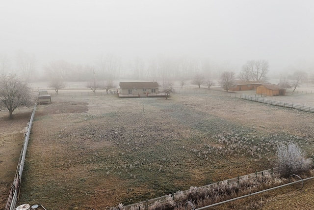 view of yard with a rural view