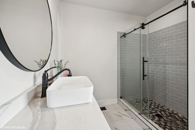 505 Sweetgrass Ranch Rd, Kalispell, MT 59901 - bathroom featuring marble look tile flooring, a shower stall, and vanity