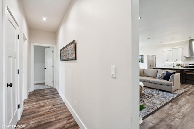 hallway with wood-type flooring