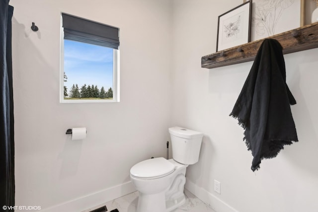 505 Sweetgrass Ranch Rd, Kalispell, MT 59901 - half bath featuring toilet and marble finish floors