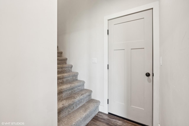 stairway featuring hardwood / wood-style flooring