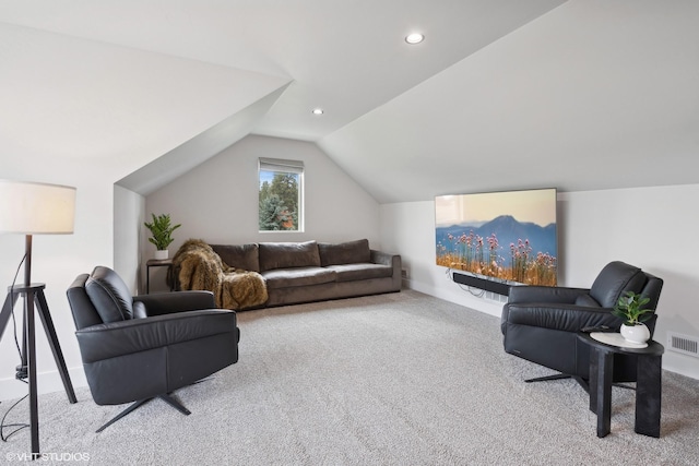 living room featuring light colored carpet and vaulted ceiling