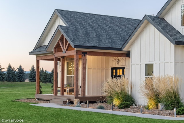 outdoor structure at dusk with a yard