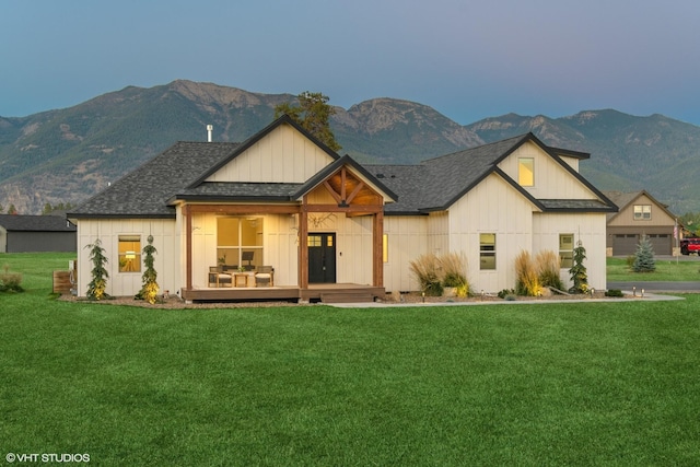 505 Sweetgrass Ranch Rd, Kalispell, MT 59901 - modern farmhouse style home with a mountain view, a front yard, board and batten siding, and a shingled roof