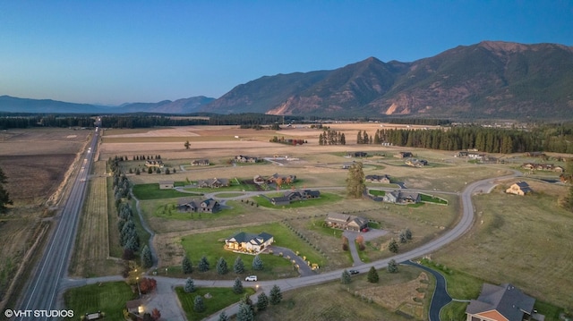 bird's eye view featuring a mountain view and a rural view