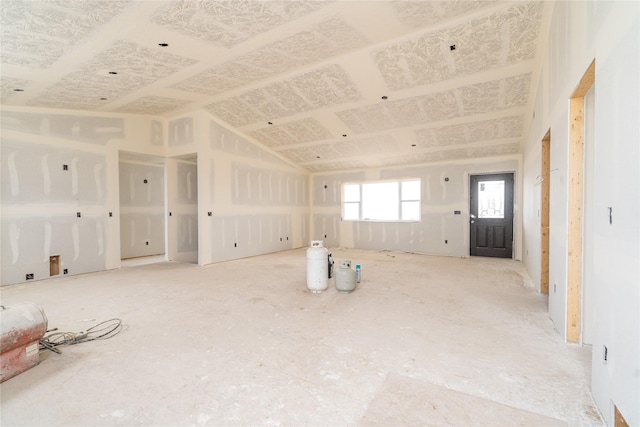 empty room with lofted ceiling