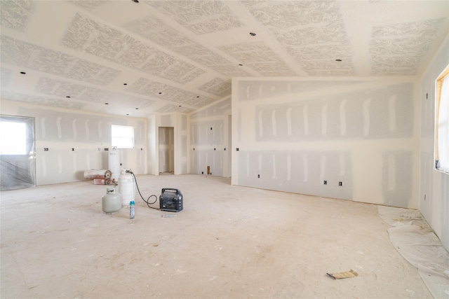 interior space with plenty of natural light and vaulted ceiling