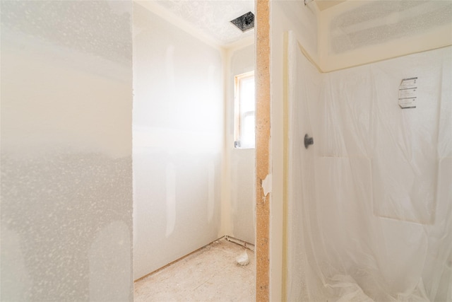 bathroom with a shower with shower curtain