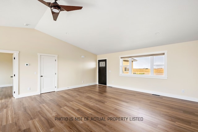 unfurnished living room with ceiling fan, light hardwood / wood-style floors, and vaulted ceiling