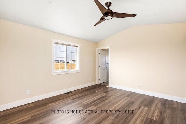 unfurnished room featuring ceiling fan, dark wood-type flooring, and lofted ceiling