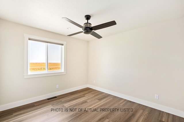 unfurnished room featuring ceiling fan and hardwood / wood-style floors