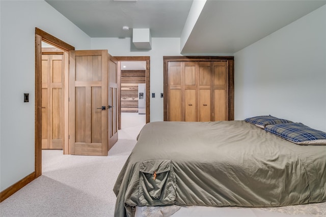 bedroom with white refrigerator with ice dispenser and light carpet