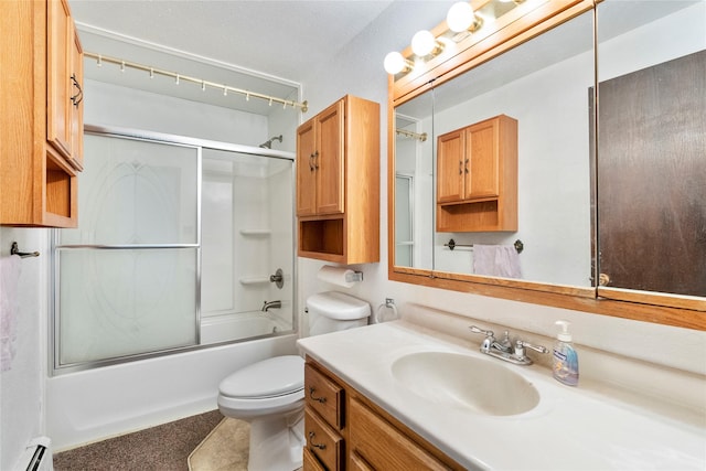 bathroom with toilet, combined bath / shower with glass door, a baseboard radiator, and vanity