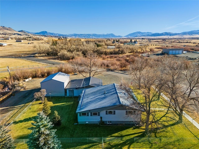 birds eye view of property with a mountain view