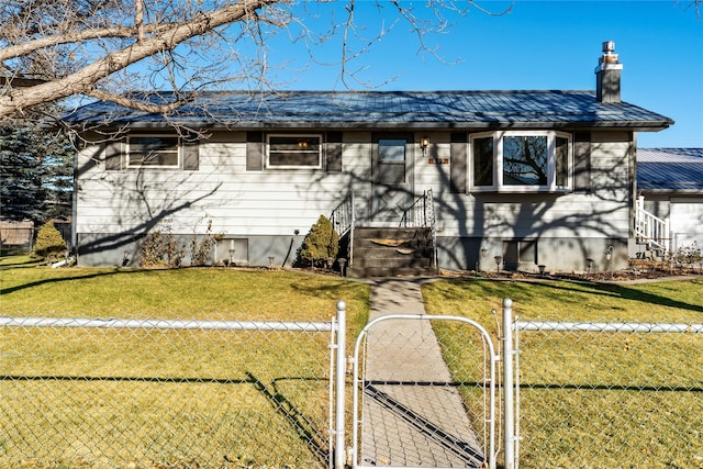 view of front of property with metal roof, fence, a gate, a chimney, and a front yard