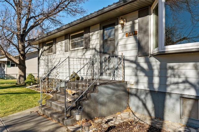 view of side of property with a yard