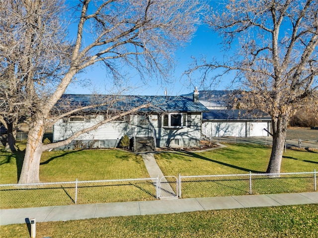 single story home with a fenced front yard and a front lawn