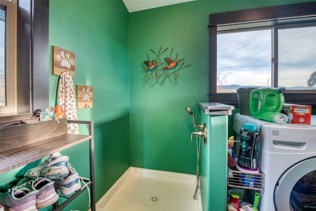 clothes washing area with washer / dryer