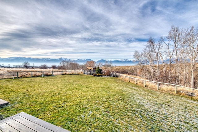 view of yard featuring a rural view and a mountain view