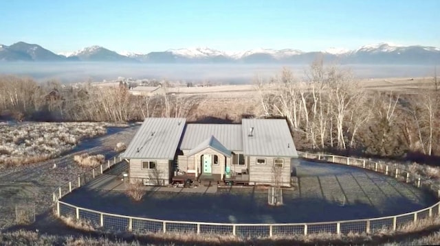 back of property featuring a mountain view