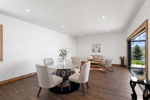 dining area with baseboards, dark wood-style flooring, and recessed lighting