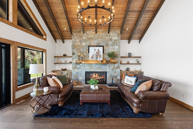 living area with wooden ceiling, a fireplace, baseboards, and beam ceiling