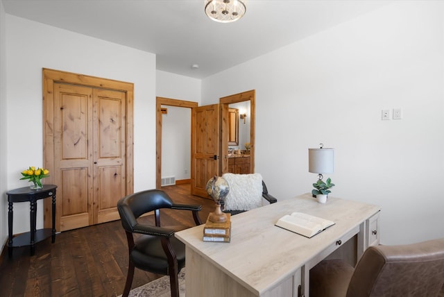 office space with dark wood-style floors and visible vents