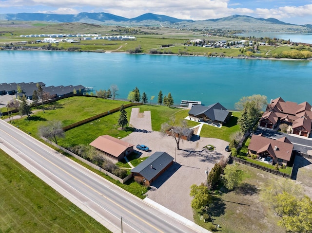 birds eye view of property with a residential view and a water and mountain view