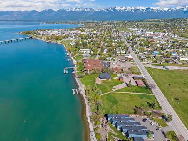 drone / aerial view with a residential view and a water and mountain view