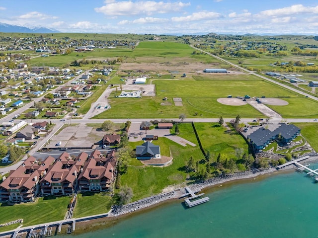 drone / aerial view featuring a water view and a residential view