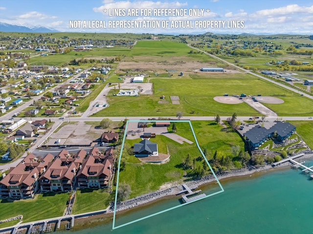 birds eye view of property with a residential view and a water view