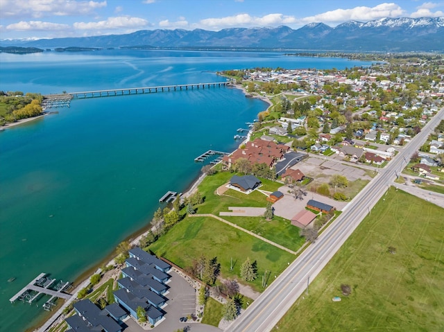 birds eye view of property with a residential view and a water and mountain view