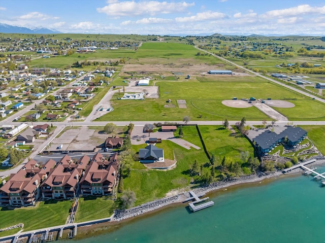 birds eye view of property featuring a water view and a residential view