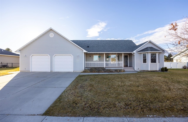 ranch-style home with a front yard, a garage, and covered porch