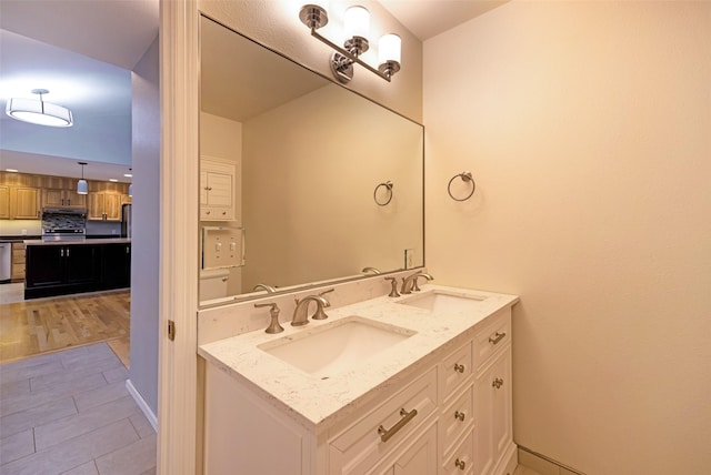 bathroom with vanity and wood-type flooring