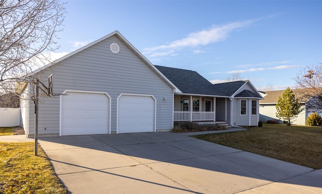 view of front facade featuring a front yard, a porch, and a garage