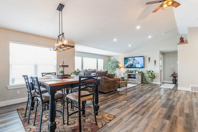 dining area featuring dark hardwood / wood-style floors, plenty of natural light, lofted ceiling, and ceiling fan