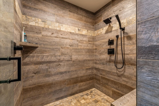 bathroom with a tile shower