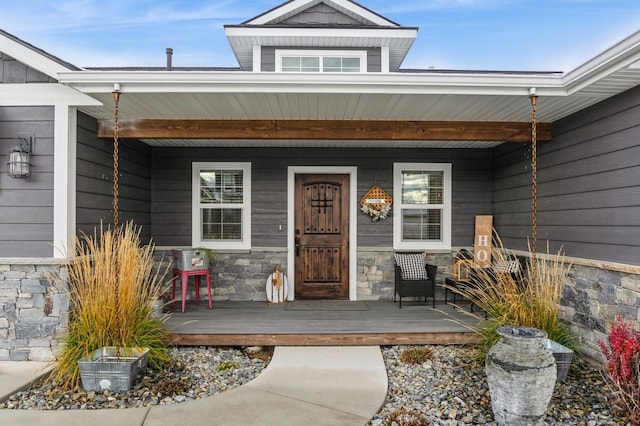 doorway to property with covered porch