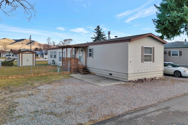 manufactured / mobile home with a shed