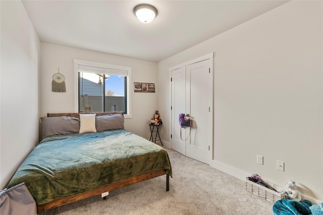 carpeted bedroom with a closet