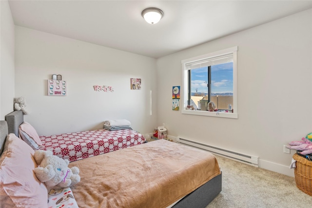 carpeted bedroom featuring baseboard heating