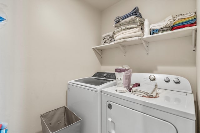 laundry area with washing machine and clothes dryer