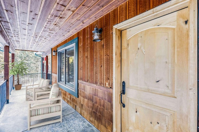 doorway to property featuring a porch