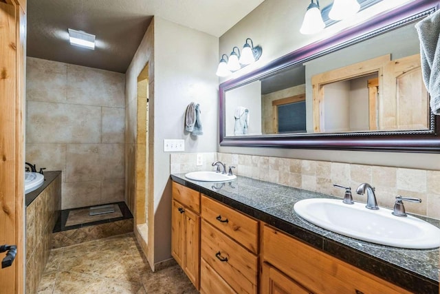 bathroom with backsplash, vanity, tile walls, and shower with separate bathtub