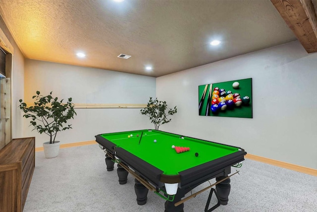 playroom with carpet flooring and a textured ceiling