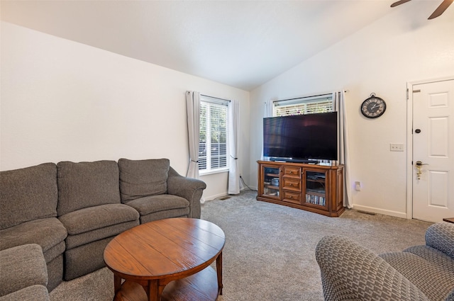 carpeted living room with ceiling fan and lofted ceiling